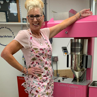 Donlee with her hot air coffee roasting machine in pink